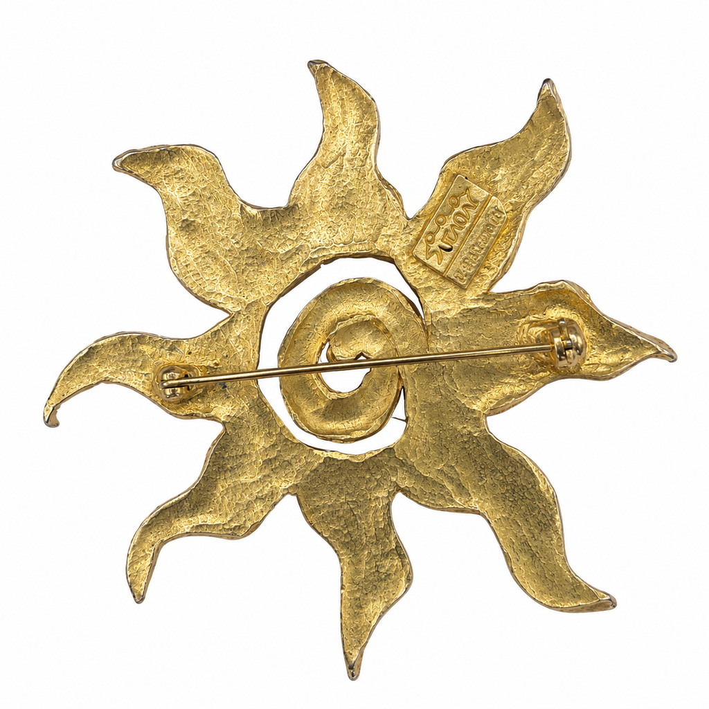 Broche vintage dorée Il était une fois – soleil sculptural années 80