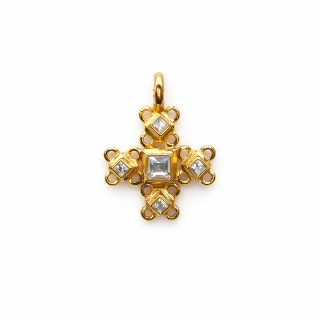 Pendentif vintage Guy Laroche en forme de croix dorée sertie de strass.